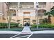 Attractive building entrance with manicured landscaping, creating a welcoming first impression for residents and visitors at 6336 Buford St # 706, Orlando, FL 32835