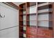 Spacious walk-in closet with custom shelving and drawer units at 6336 Buford St # 706, Orlando, FL 32835