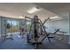 Well-equipped gym features various weight machines, treadmills, and blue carpeting, creating an ideal fitness space at 6336 Buford St # 706, Orlando, FL 32835