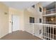 Exterior entryway hallway with door and white railings at 6336 Buford St # 706, Orlando, FL 32835