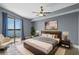 Bright main bedroom with balcony access and scenic water view at 6336 Buford St # 706, Orlando, FL 32835