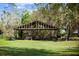 Outdoor equipment storage area with ample space for tools and machinery, set on lush lawn at 8122 Pine Island Rd, Clermont, FL 34711