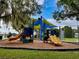 Colorful and engaging playground with slides and play structures, designed for fun and active play at 8122 Pine Island Rd, Clermont, FL 34711