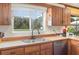 Kitchen view highlighting the sink, window, faucet, and countertop at 8155 Brocatel Ct, Orlando, FL 32822