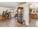 Spacious living area with wood-look flooring, a curio cabinet and a bright window at 8155 Brocatel Ct, Orlando, FL 32822