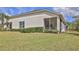 Outdoor space features a screened-in porch, creating a comfortable space for relaxation and enjoying the surrounding nature at 842 Aldenham Ln, Ormond Beach, FL 32174