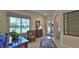 Welcoming foyer with tiled flooring, elegant furnishings, and a glass-paneled front door allowing natural light to fill the space at 842 Aldenham Ln, Ormond Beach, FL 32174