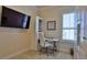 Bright home office featuring a built in desk and shelving with a large flatscreen TV at 842 Aldenham Ln, Ormond Beach, FL 32174