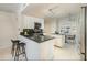 Well-lit kitchen featuring granite counters, white cabinets, and stainless steel appliances at 911 N Orange Ave # 110, Orlando, FL 32801