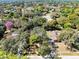 An aerial view of a home nestled among lush trees and landscaping, showing the surrounding neighborhood at 916 Puma Trl, Winter Springs, FL 32708