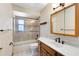 Cozy bathroom has a shower over the tub and a classic vanity at 916 Puma Trl, Winter Springs, FL 32708