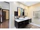 Elegant bathroom with dual sinks, stone accents, and modern fixtures at 916 Puma Trl, Winter Springs, FL 32708