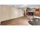 Bright living room featuring a stone fireplace, built-in shelving, wood floors, and recessed lighting at 916 Puma Trl, Winter Springs, FL 32708