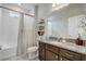 Charming bathroom with a vanity, commode, and shower featuring a patterned curtain for a stylish and functional space at 10139 Grande Loop, Clermont, FL 34711