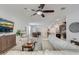 Bright living room boasts an open layout connecting the kitchen and dining area, perfect for modern living and entertaining at 10139 Grande Loop, Clermont, FL 34711