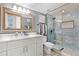 Modern bathroom with a glass-enclosed shower, updated vanity, and elegant fixtures at 113 Avalon Dr, Ormond Beach, FL 32176