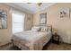 Bedroom with a ceiling fan, queen bed, and nautical themed decor at 113 Avalon Dr, Ormond Beach, FL 32176