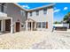 Two-story home with neutral siding, a decorative compass rose, and a welcoming front entrance at 113 Avalon Dr, Ormond Beach, FL 32176