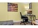 Cozy home office featuring a comfortable chair, desk, and calming artwork, perfect for productivity at 113 Avalon Dr, Ormond Beach, FL 32176