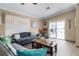 Comfortable living room with hardwood floors, leading to a patio with sliding glass doors and ample natural light at 113 Avalon Dr, Ormond Beach, FL 32176