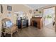 Comfortable home office with wooden floors and beach-themed decor at 113 Avalon Dr, Ormond Beach, FL 32176