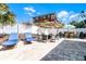 Paver patio featuring outdoor seating and lounge chairs, perfect for entertaining and relaxing at 113 Avalon Dr, Ormond Beach, FL 32176
