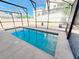 Enclosed pool area with refreshing blue water and surrounding patio space at 113 Avalon Dr, Ormond Beach, FL 32176