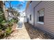 Side yard with HVAC unit and pebble landscaping at 113 Avalon Dr, Ormond Beach, FL 32176