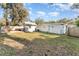 This backyard has a shed and an open grassy area perfect for outdoor activities at 1140 W Seminole Trl, Bartow, FL 33830