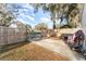 Fenced backyard featuring a concrete pad and wooden perimeter at 1140 W Seminole Trl, Bartow, FL 33830