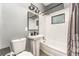 Well-lit bathroom featuring subway tile surround, a shower and tub, and a pedestal sink at 1140 W Seminole Trl, Bartow, FL 33830