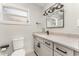 Modern bathroom featuring a single sink vanity with gray cabinets and black hardware at 1140 W Seminole Trl, Bartow, FL 33830