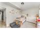 Cozy bedroom featuring light walls, wood-look floors, white furniture, and decorative accents at 1140 W Seminole Trl, Bartow, FL 33830