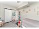 Bright bedroom with wood-look floors and a closet with a white sliding barn door at 1140 W Seminole Trl, Bartow, FL 33830