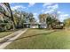 Charming single-story home features a welcoming front lawn and covered parking at 1140 W Seminole Trl, Bartow, FL 33830