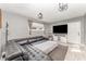 Spacious living room with modern decor, wood-look tile floors, and a comfortable sofa at 1140 W Seminole Trl, Bartow, FL 33830