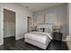 Well-lit bedroom showcases hardwood floors, a large closet, and neutral decor at 1593 Evening Summit Cir, Minneola, FL 34715