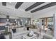 Open-concept living space with an island kitchen, dining area, and great room with access to an outdoor patio at 1593 Evening Summit Cir, Minneola, FL 34715