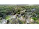 Aerial view of neighborhood, showcasing tree coverage, and street layout at 1601 E 1St Ave, Mount Dora, FL 32757