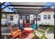 Cozy outdoor space with covered pergola and seating area at 1601 E 1St Ave, Mount Dora, FL 32757