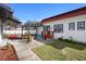 Outdoor patio area with pergola and colorful patio furniture at 1601 E 1St Ave, Mount Dora, FL 32757