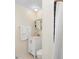 Bathroom featuring a white vanity, white towels, and a shower with a curtain at 1601 E 1St Ave, Mount Dora, FL 32757