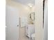 Bathroom featuring a white vanity, white towels, and a shower with a curtain at 1601 E 1St Ave, Mount Dora, FL 32757