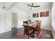 Spacious dining room featuring hardwood floors and ample seating at 1601 E 1St Ave, Mount Dora, FL 32757