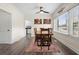 Dining room boasts natural light, views to kitchen and an eclectic lizard decoration at 1601 E 1St Ave, Mount Dora, FL 32757