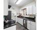 Modern kitchen with stainless steel appliances and granite countertops at 1601 E 1St Ave, Mount Dora, FL 32757