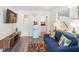 Comfortable living room with a cozy sofa, bright accents, and access to the bathroom and kitchen at 1601 E 1St Ave, Mount Dora, FL 32757