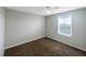 This bedroom has carpet flooring and natural light from the window at 1613 Reflection Cv, St Cloud, FL 34771