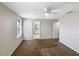 Bedroom with natural light, carpet, ceiling fan, and en suite bathroom at 1613 Reflection Cv, St Cloud, FL 34771