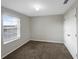 Bedroom with natural light from the window and carpeted flooring at 1613 Reflection Cv, St Cloud, FL 34771